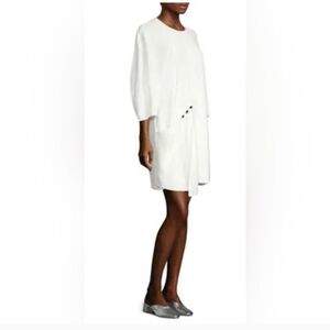 Tibi Asymmetric Flap Front Dress in white. 